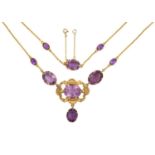 An Amethyst Necklacethree oval cut amethysts in yellow claw settings, the central one within an