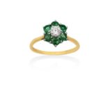 An 18 Carat Gold Emerald and Diamond Ringthe central raised round brilliant cut diamond within a