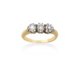 A Diamond Three Stone Ringthe old cut diamonds in yellow claw settings, to a tapered shoulder