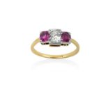 A Ruby and Diamond Three Stone Ringthe old cut diamond flanked by cushion shaped rubies, in white