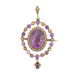 An Early 20th Century Amethyst and Split Pearl Brooch/Pendantthe oval cut amethyst within a border