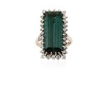 An 18 Carat White Gold Green Tourmaline and Diamond Cluster Ringthe rectangular step cut green