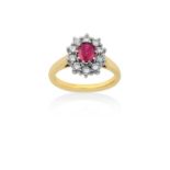 An 18 Carat Gold Ruby and Diamond Cluster Ringthe oval cut ruby within a border of round brilliant
