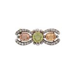 A Late 19th Century Peridot, Topaz and Diamond Broochthe round cut peridot flanked by oval cut topaz