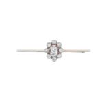 A Diamond Bar Broochthe central old cut diamond within an openwork border of smaller old cut