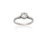 A Diamond Solitaire Ringthe old cut diamond in a white claw setting, to a tapered shoulder plain