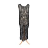 Circa 1920s Black Bead and Sequin Dress on a sheer net base, sleeveless with a scooped neckline