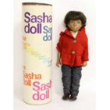 Late 1960/Early 1970s Gregor Sasha Doll, with brown wig, wearing a white shirt, red felt hooded