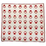 Circa 1880 American Quilt Appliquéd with Turkey Red Flower Baskets, on a white cotton ground, finely