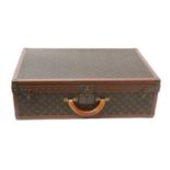 Louis Vuitton Suitcase 70 in monogrammed canvas, leather and brass bound with a rounded leather