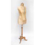 An Early 20th Century Stockman Mannequin Paris, with fabric mount on a tripod baseStaining and