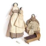 19th Century Small Wooden and China Dolls, comprising a Grodnertal figure with moulded black hair,