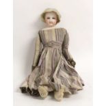 A Late 19th Century French Fashion Doll Possibly by Gaultier, with a bisque shoulder head, impressed
