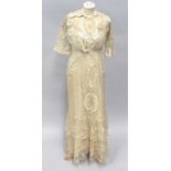 Circa 1900s Wedding Dress in white silk mounted with net, embroidered with floral motifs, lace '