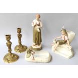 Three Royal Dux figures and a pair of gilt metal candlesticks (5)All in good condition.