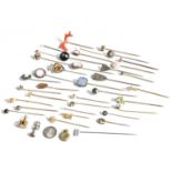 Thirty-Seven Stickpins, of varying designs including hardstones, coral, cameos, horseshoe motifs,