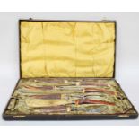 A Cased Seven Piece Antler-Handled Carving Set, with silver collars, by Thomas H. Blake,