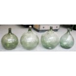 Four Green Glass Carbouys, largest approx 44cm