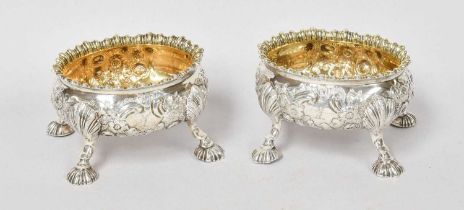 A Pair of George III Silver Salt-Cellars, by David Hennell, London, 1762, each oval and on shell-