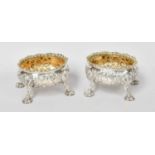 A Pair of George III Silver Salt-Cellars, by David Hennell, London, 1762, each oval and on shell-