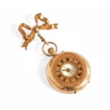 A Lady's 9 Carat Gold Half Hunter Fob Watch, together with a 9 Carat Gold Bow Brooch