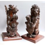 A Pair of Victorian Carved Oak Newel Post Finials, caved as heraldic lion and dragon