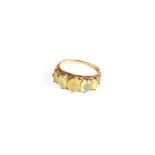 A Green Five Stone Ring, finger size N1/2Marks rubbed, in our opinion would test as gold. Evidence
