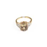 An 18 Carat Gold Csarite and Diamond Ring, finger size N1/2The ring is in good condition. It is