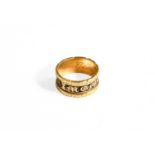 An 18 Carat Gold Mourning Ring, enamelled in black and engraved to the inside Georgie, finger size