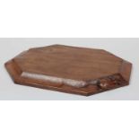 Workshop of Robert Mouseman Thompson (Kilburn): An English Oak Bread Board, of octagonal form,