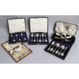 Four Cased Sets of Silver Coffee-Spoons, one set of six with Apostle terminals; another set of six