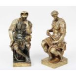 A Pair of Bronze Figures of Seated Roman Centurians