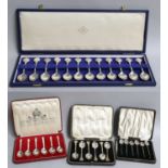 Four Cased Sets of Spoons, comprising a cased set of twelve Elizabeth II silver teaspoons, by John