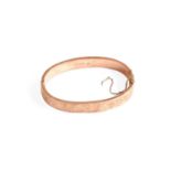 A 9 Carat Gold Hinged Bangle, inner measurements 5.7cm by 5.1cm (a.f.)Gross weight 8.7 grams.