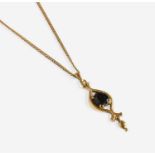 A 9 Carat Gold Garnet Pendant on A 9 Carat Gold Chain, pendant length 5.0cm, chain length