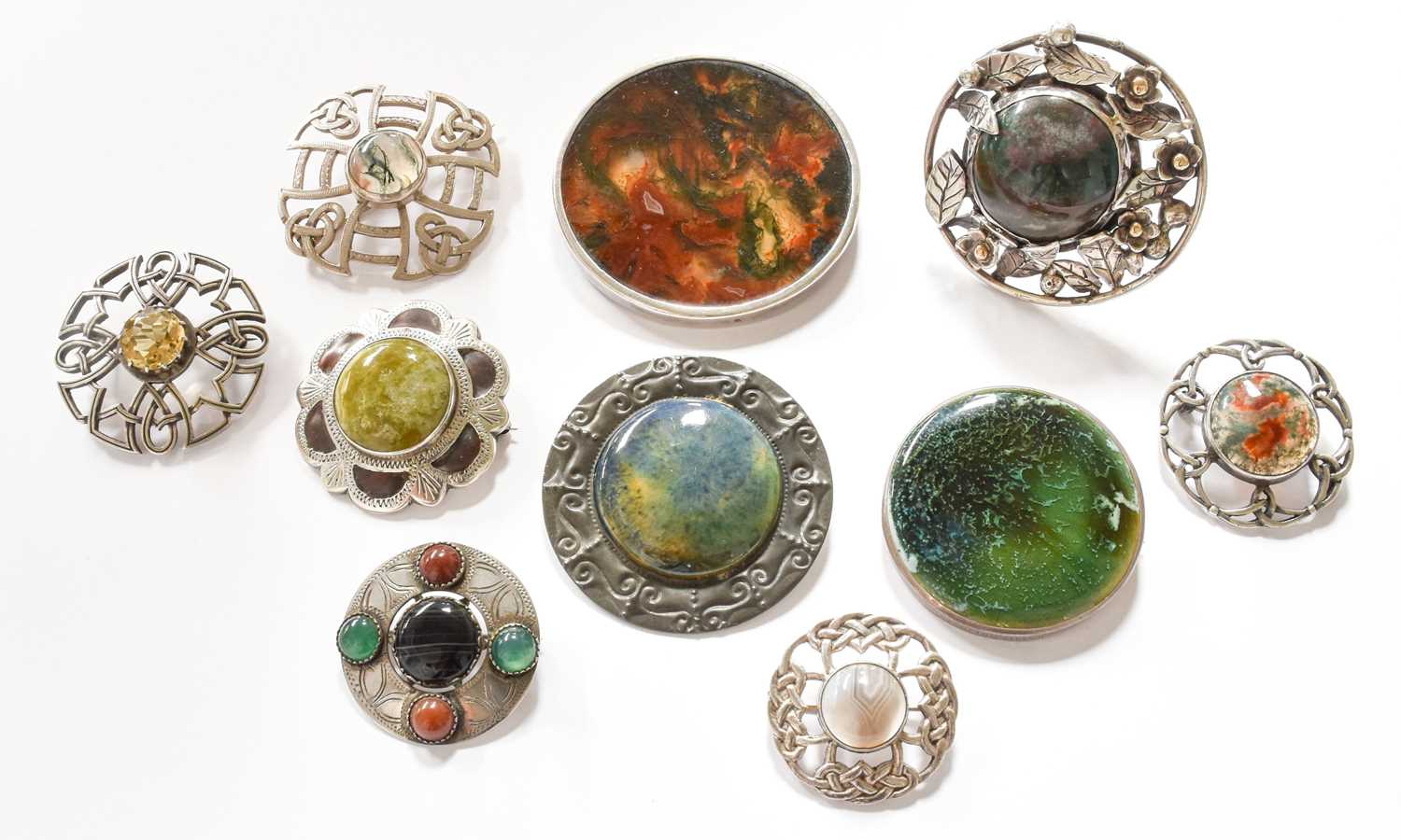 Nine Silver/White Metal Brooches and a Ring, including various hardstone examples, a Ruskin