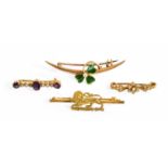 Four Brooches, comprising of an enamel clover motif example, an amethyst and split pearl example,