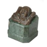 A Small Bronze Sculpture of the Head of a Crying Baby, on a verde antico marble pedestal