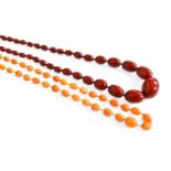 A Graduated Amber Bead Necklace, length 112cm; together with A Graduated Red Amber Bead Necklace,