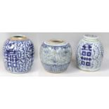Three Chinese Porcelain Ginger Jars, painted in underglaze blue with lotus scrolls, with cover,