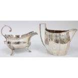 A George III Silver Sauceboat, London, 1776, oval and on three shell-capped feet, with leaf-capped