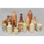 A Small Quantity of Advertising Stoneware Bottles, similar salt glazed flagons, a two Wade whisky