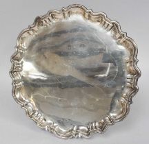 An Edward VII Silver Salver, by Roberts and Belk, Sheffield, 1903, shaped circular and on three