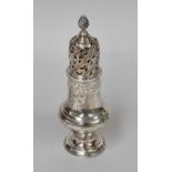 A George III Silver Caster, by Robert Peaston, London, 1762, vase-shaped and on spreading foot,
