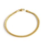 An 18 Carat Gold Flat Curb Link Bracelet, length 20cmGross weight 6.6 grams.