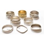 Eight Silver and White Metal Bangles, of varying designs and sizes, including a buckle motif