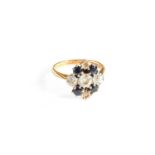 A Sapphire and Diamond Cluster Ring, stamped '18CT' and 'PLAT', finger size J1/2Gross weight 3.8