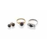 An 18 Carat Gold Sapphire and Diamond Cluster Ring, finger size K; An 18 Carat White Gold Sapphire