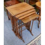 A 19th Century Rosewood Nest of Tables, raised on ring turn supports, largest 52cm by 39cm by 75cm