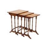 A Nest of Three Regency Style Yewwood and Crossbanded Nesting Tables, largest 51cm by 34cm by 59cm